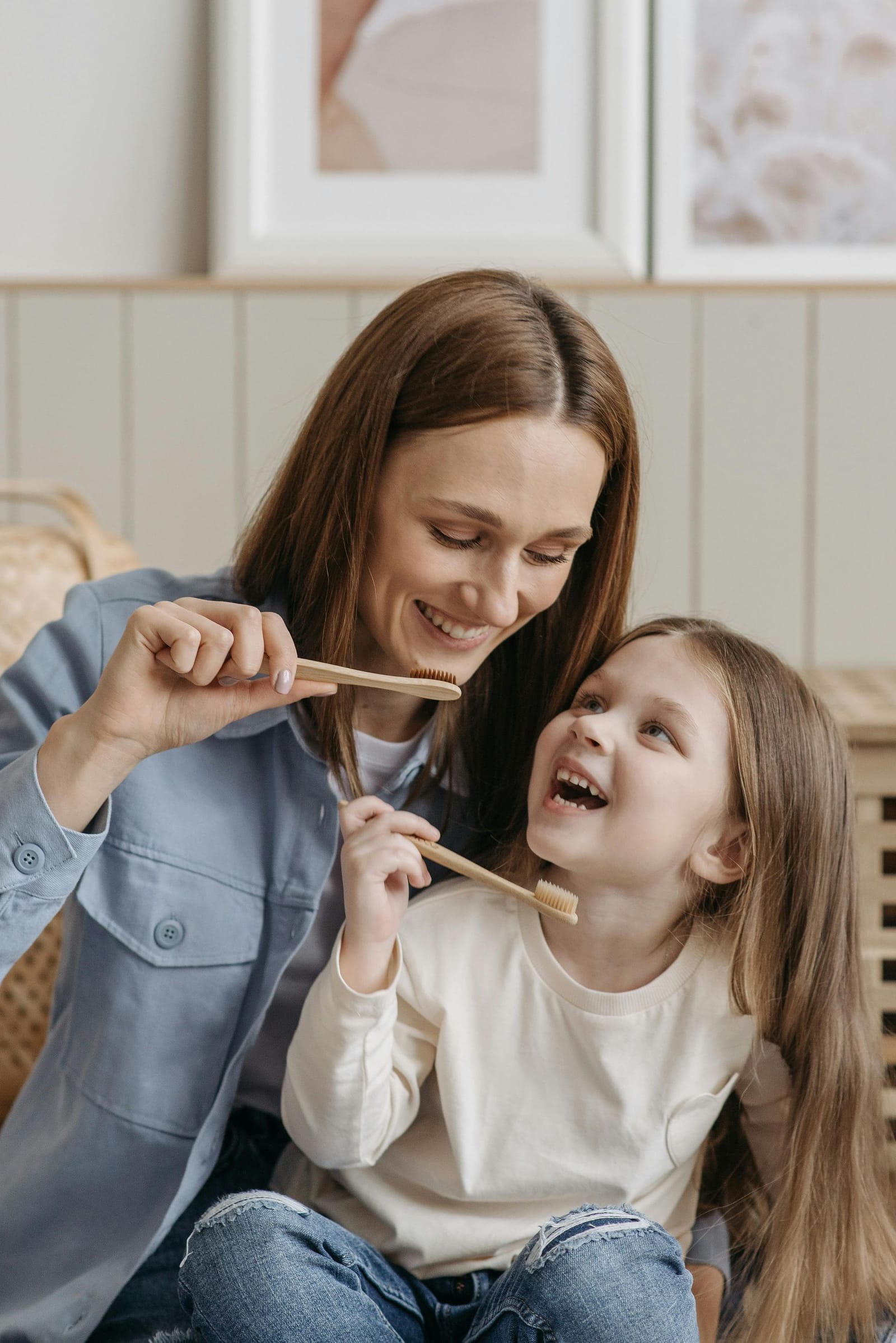 A therapist working one-on-one with a young girl during an ABA session.